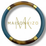 Lakeret armbånd i bøffelhorn fra Maison Kizo - 4 farver